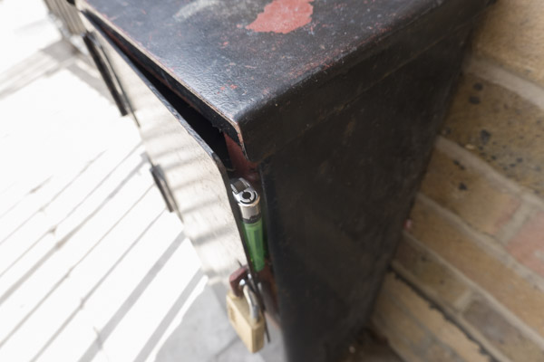 a pair of cheap silver high heeled shoes lie discarded in the doorway