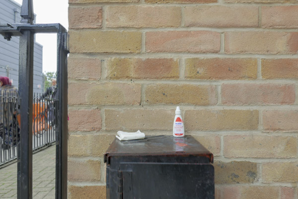 a pair of cheap silver high heeled shoes lie discarded in the doorway